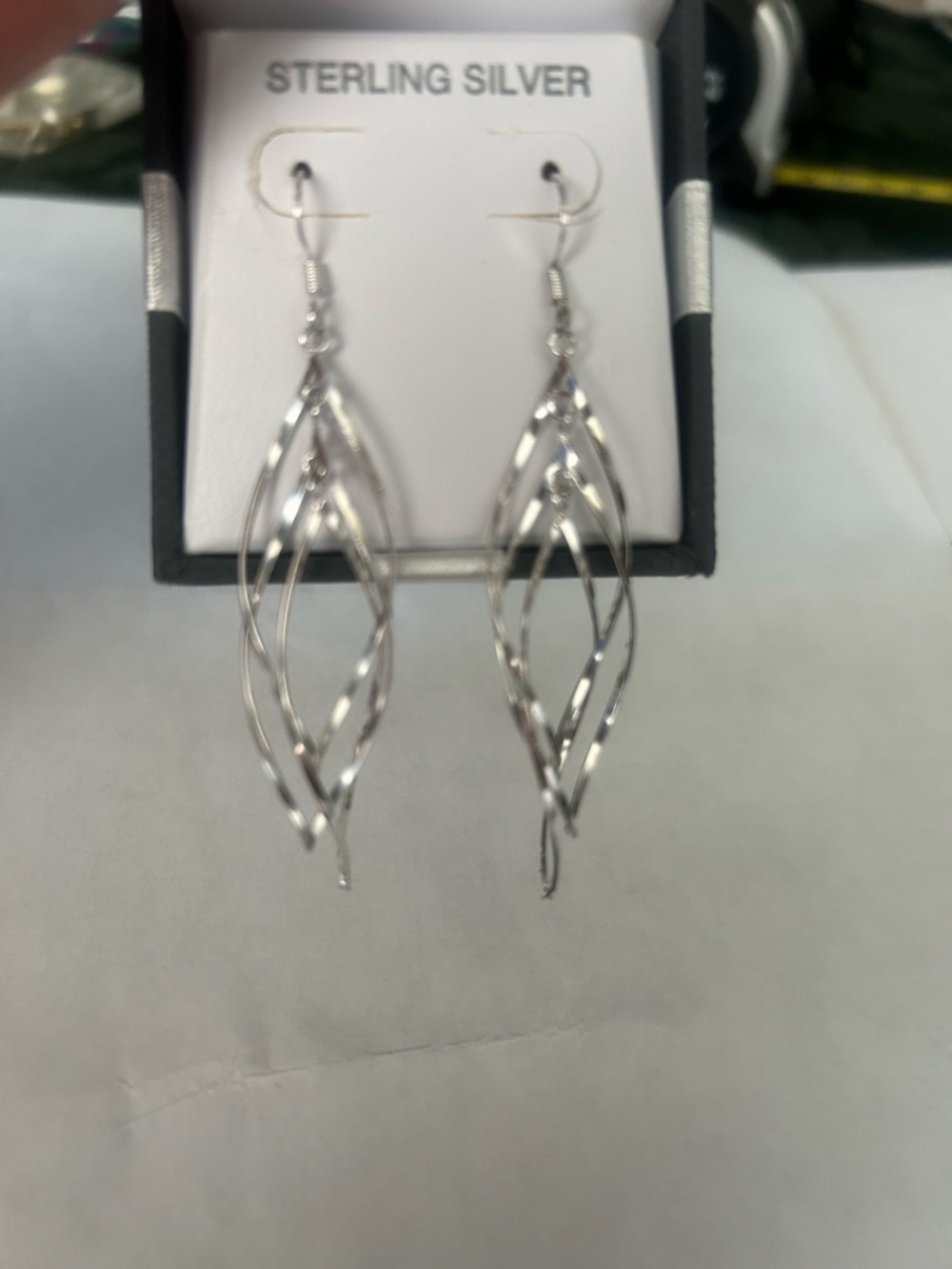 Sterling silver earrings. NWT open twist drop style.
